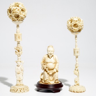 Two Chinese Canton ivory puzzle balls on stands and a figure of a sage, 19th C.