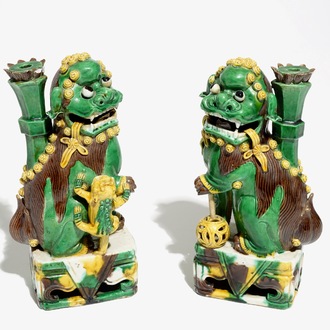 A pair of Chinese verte biscuit joss stick holders shaped as Buddhist lions, Kangxi