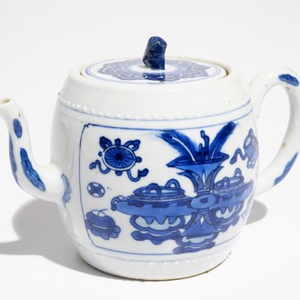 A Chinese blue and white teapot and cover with antiquities, Kangxi