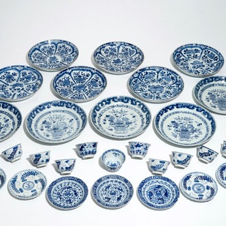 Eleven Chinese blue and white plates, eleven cups and seven saucers, Kangxi and later