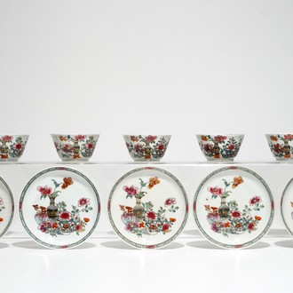 Five Chinese famille rose cups and saucers with vases among flowers, Yongzheng/Qianlong