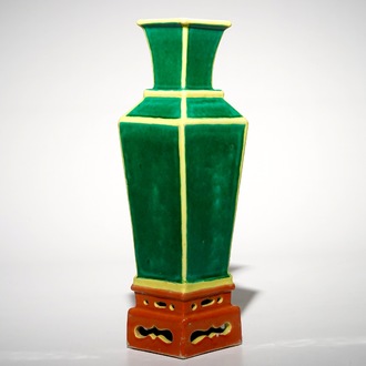 A tapered square Chinese vase on stand in green, yellow and orange, 19/20th C.