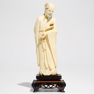 A Chinese ivory figure of a scholar, 19th C.