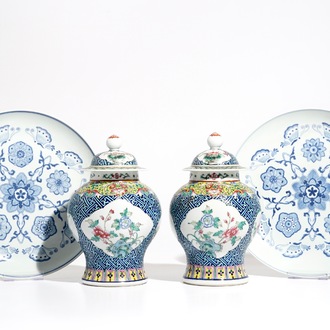 A pair of Chinese famille rose vases and covers, 19th C., and a pair of blue and white dishes, 20th C.