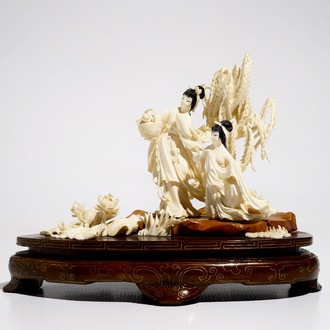 A Chinese carved ivory group of two ladies on wooden base, 2nd quarter 20th C.