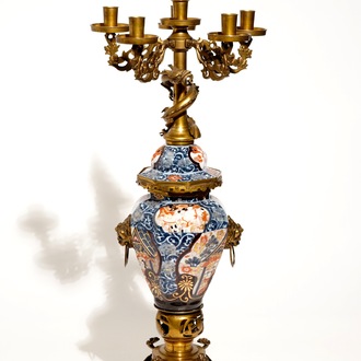 A large brass and gilt bronze-mounted Japanese Imari vase and cover candelabra, 19th C.