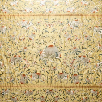 A Chinese embroidered yellow-ground silk cloth with peaches, Qing