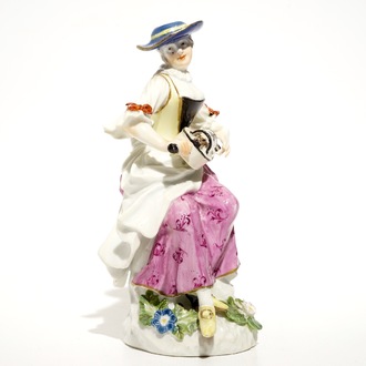 A Meissen porcelain Commedia del'Arte figure of Colombine playing a hurdy-gurdy, Germany, 18th C.