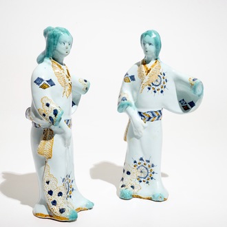 A pair of French faience models of Chinamen, Strasbourg, 18th C.