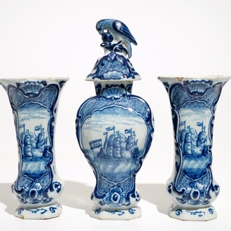 A Dutch Delft blue and white three-piece garniture with a naval scene, 18th C.