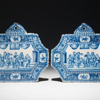 A pair of fine Dutch Delft blue and white plaques with an interior scene, 18th C.