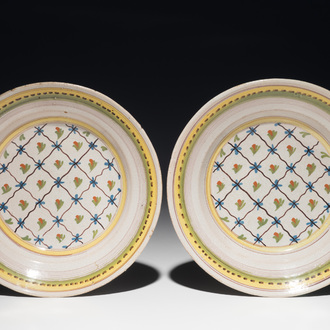 A pair of polychrome Brussels faience plates, 1st half 19th C.