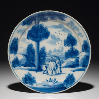 A Dutch Delft blue and white plate with figures in a landscape, 1st half 18th C.