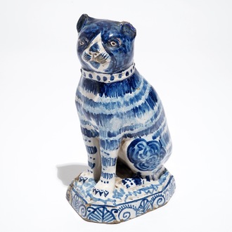 A Dutch Delft blue and white model of a cat, 1st half 19th C.