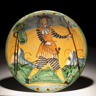 A polychrome Italian maiolica dish with a soldier, Montelupo, 17th C.