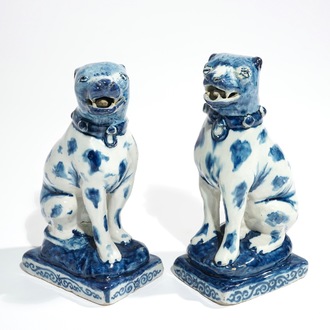 A pair of Dutch Delft blue and white models of dogs, 1st half 18th C.