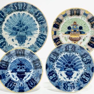 Four Dutch Delft blue and white and polychrome peacock's tail plates, 18th C.