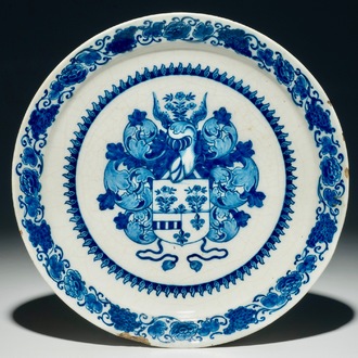 A Dutch Delft blue and white armorial plate, 1st half 18th C.