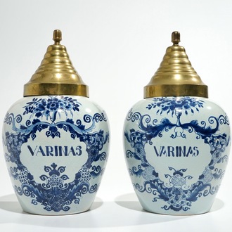 A pair of Dutch Delft blue and white tobacco jars, 19th C.