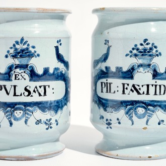 A pair of French faience Delft style albarello drug jars, Lille, 18th C.