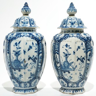 A pair of Dutch Delft blue and white chinoiserie covered vases, 18th C.