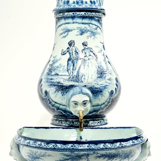 A blue and white French faience Delft style wall fountain and basin, Bourg-la-Reine, dated 1890