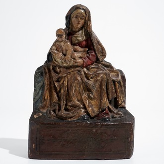 A Flemish carved and polychromed oak Madonna with child, 1st half 16th C.