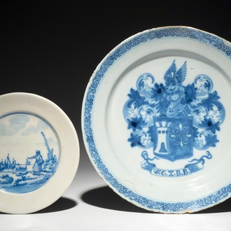 A Dutch Delft blue and white armorial dish dated 1683 and a blue and white landscape plate, 17th C.