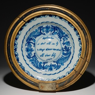 A Dutch Delft blue and white cardinal's dish in frame, dated 1787