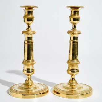 A pair of gilt bronze Empire candlesticks, France, 19th C.