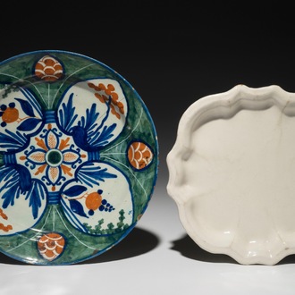 A polychrome Dutch Delft "Four-hearts" plate and a quatrefoil white Delft plate, 18th C.