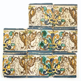 Eight Spanish or Portuguese tiles with putti and crowned eagles, 17th C.