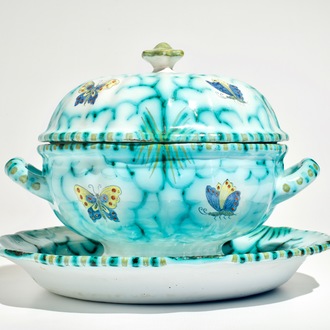 A polychrome Brussels faience tureen on stand with butterflies and caterpillars, 18/19th C.