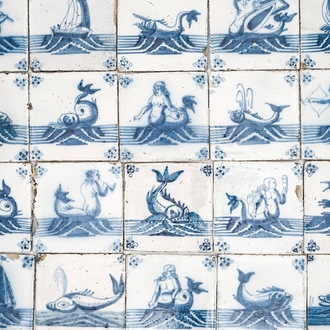 A field of 67 Dutch Delft blue and white tiles with sea creatures and ships, 18th C.