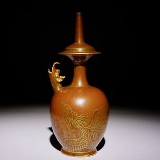 A Chinese monochrome persimmon-glazed kundika with applied gilt decoration, 18/19th C.