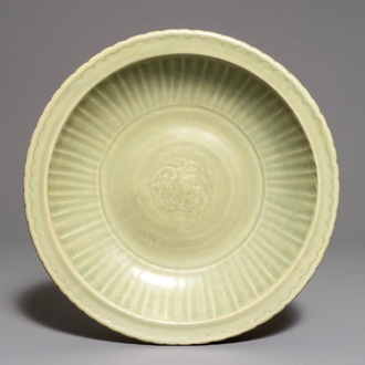 A Chinese Longquan celadon charger with underglaze dragon, Ming