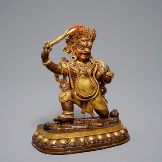 A Sino-Tibetan gilt bronze figure of Mahakala, 19th C.