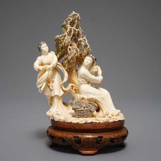 A Chinese carved ivory group of two ladies on inlaid wooden base, 1st half 20th C.