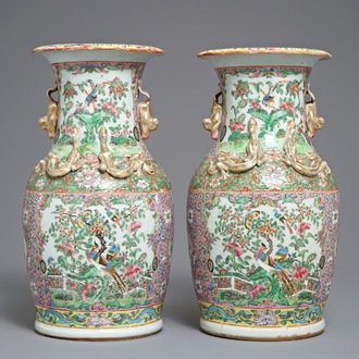 A pair of Chinese pink ground Canton vases, 19th C.