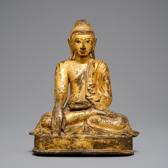 A large Burmese inlaid, gilt and lacquered bronze Mandalay-style Buddha, 19th C.