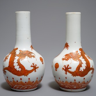 A pair of Chinese iron red and gilt bottle vases with dragons, Wanli mark, 19th C.
