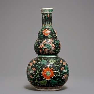 A Chinese black-ground famille verte double gourd dragon vase, 19th C.