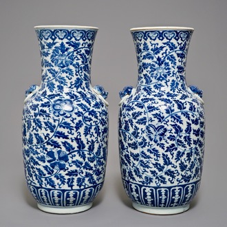 A pair of Chinese blue and white flower scroll vases, 19th C.