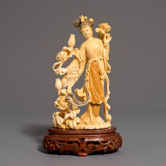 A Chinese carved ivory figure of Chang'e on wooden base, 1st half 20th C.