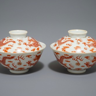 A pair of Chinese iron red dragon bowls and covers, Xianfeng mark, 19/20th C.