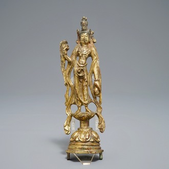 A Chinese gilt bronze figure of Guanyin, Tang or later