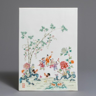 A Chinese famille rose plaque with boys in a landscape, Guangxu mark, Republic, 1st half 20th C.