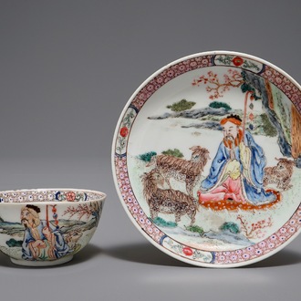 A Chinese famille rose cup and saucer depicting Lie Ti Guai with three goats, Yongzheng