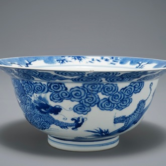 A Chinese blue and white klapmuts bowl with a tiger fighting a dragon, Chenghua mark, Kangxi