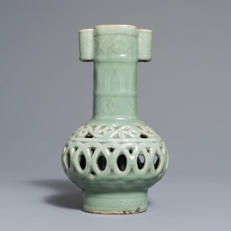 A Chinese celadon-glazed reticulated double-walled vase, 19/20th C.